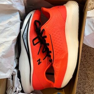 New Balance Neon Orange Athletic Running Shoes with Black Accents